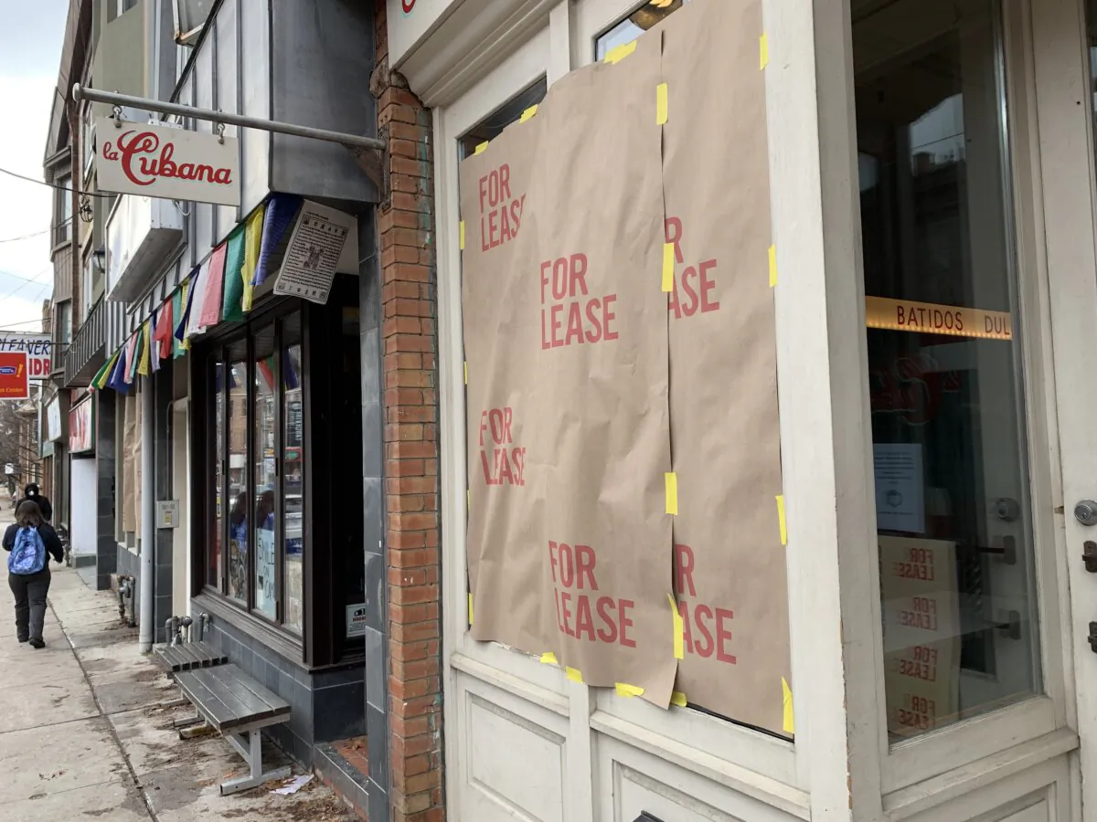 A storefront on Roncesvalles Avenue displays a "for lease" sign as part of a protest against the Ontario government's pandemic lockdown rules in Toronto on Nov. 24, 2020. (The Canadian Press/Jody White)