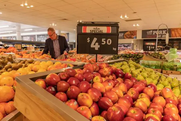 People buy vegetables and fruits in a supermarket in Canberra, Australia, July 27, 2022. (Chu Chen/Xinhua via Getty Images)