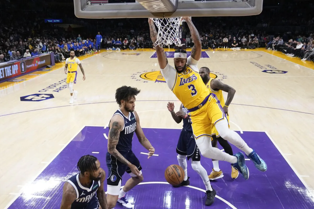 Los Angeles Lakers forward Anthony Davis (3) dunks against the Dallas Mavericks during the first half of an NBA basketball game in Los Angeles on Jan. 17, 2024. (Marcio Jose Sanchez/AP Photo)