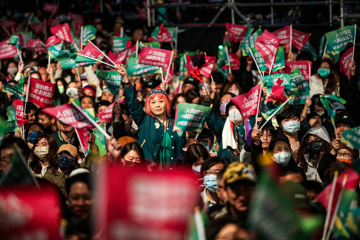 Supporters of Taiwan's current vice president, now the president-elect, from the Democratic Progressive Party (DPP) wait for President-elect Lai Ching-te to speak at the party's headquarters in Taipei, Taiwan, on Jan. 13, 2024. (Annice Lyn/Getty Images)
