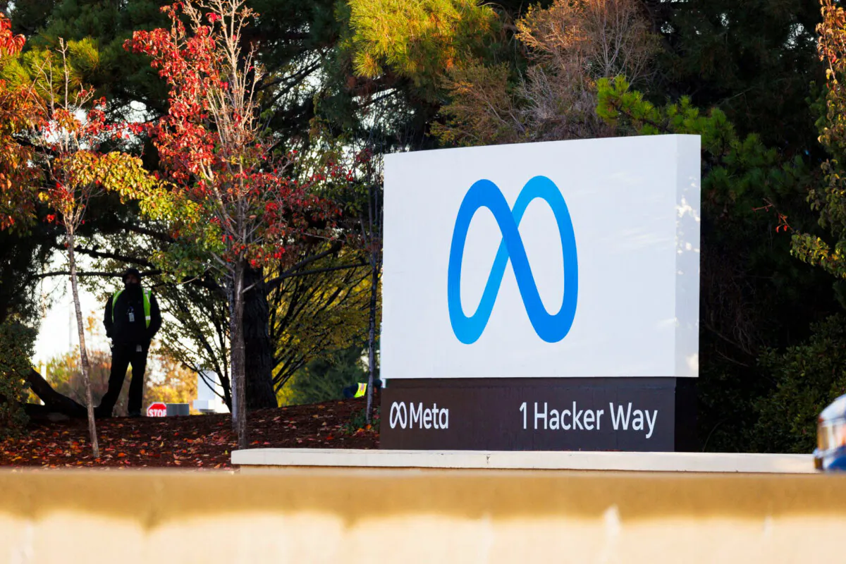 A security guard stands watch by the Meta sign outside the headquarters of Facebook parent company Meta Platforms Inc in Mountain View, Calif., on Nov. 9, 2022. (Peter DaSilva/Reuters)