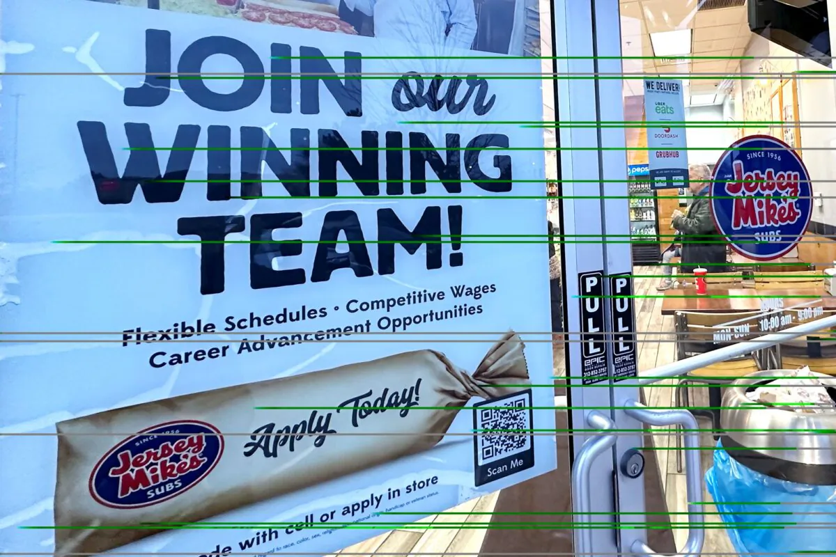 A hiring sign is displayed at a restaurant in Mount Prospect, Ill., on Dec. 4, 2023. (Nam Y. Huh/AP Photo)
