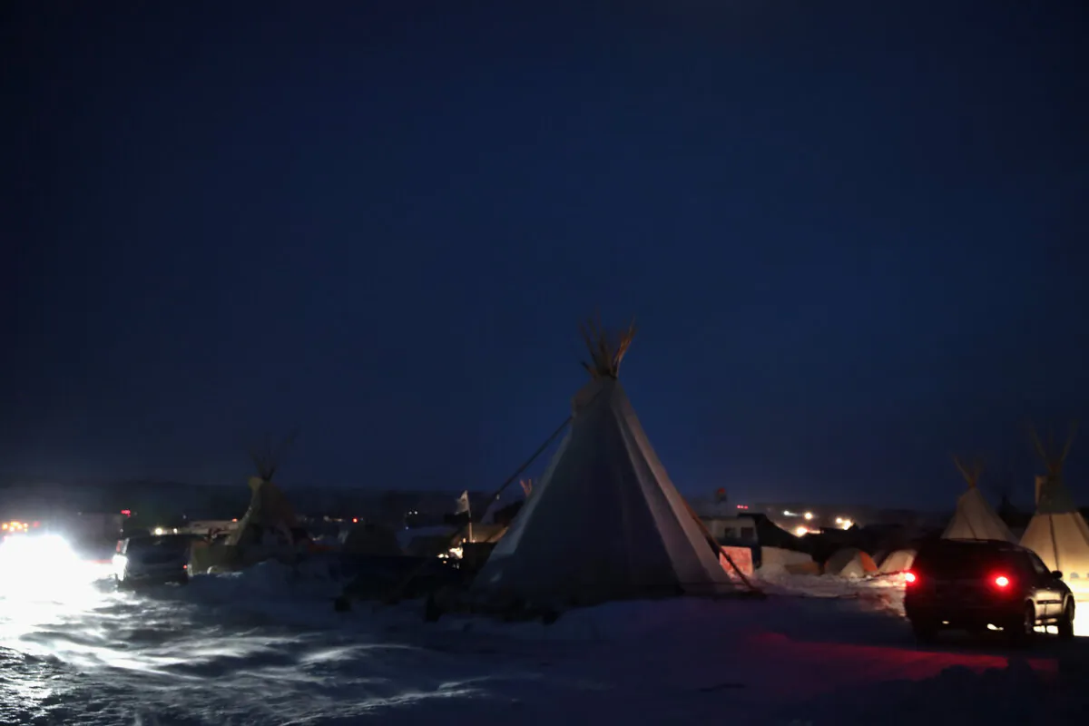 Activists at Oceti Sakowin near the Standing Rock Sioux Reservation brace for sub-zero temperatures expected overnight outside Cannon Ball, N.D., on Dec. 6, 2016. (Scott Olson/Getty Images)