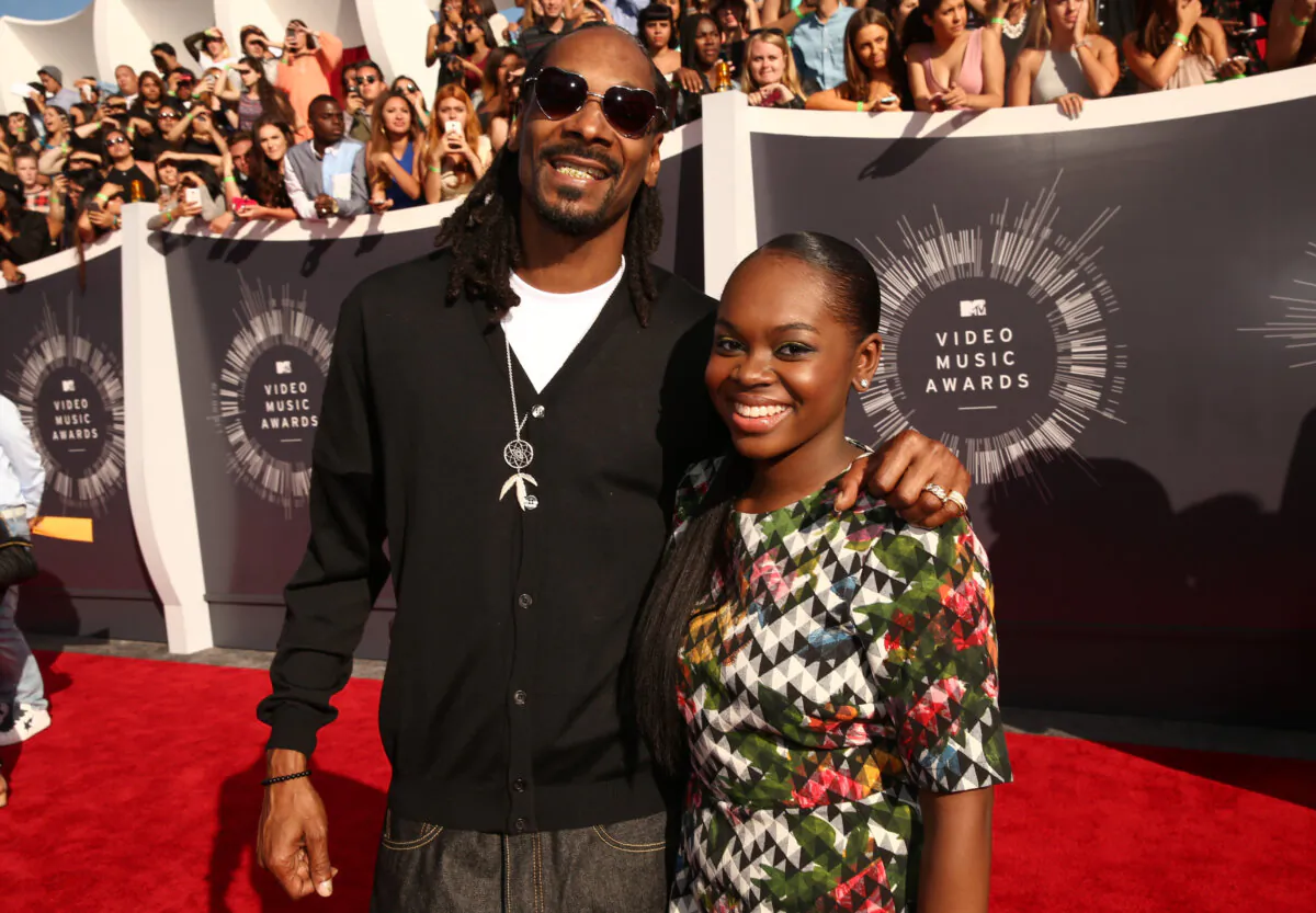 Recording artist Snoop Dogg and his daughter, Cori Broadus, attend the 2014 MTV Video Music Awards at The Forum in Inglewood, California, on Aug. 24, 2014. (Photo by Christopher Polk/Getty Images for MTV)