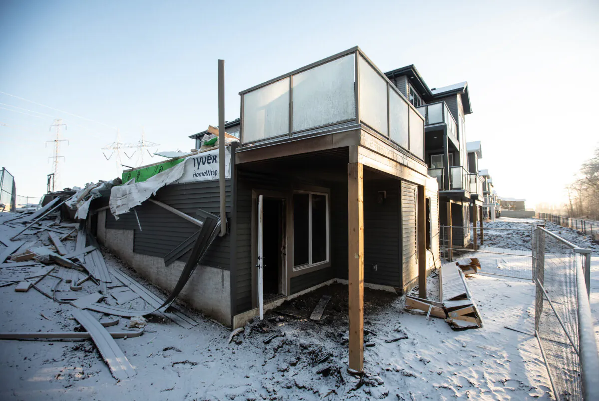 The remnants of a newly built home that was burnt down and is under investigation of arson in Edmonton Jan. 5, 2024. City police are investigating a series of extortion schemes with the common thread of targeting business owners in the South Asian community. (The Canadian Press /Jason Franson)