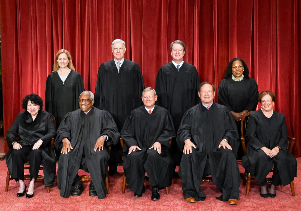 Justices of the U.S. Supreme Court pose for their official photo at the Supreme Court in Washington on Oct. 7, 2022. (Front L–R) Justices Sonia Sotomayor and Clarence Thomas, Chief Justice John Roberts, Justice Samuel Alito, and Justice Elena Kagan. (Back L–R) Justices Amy Coney Barrett, Neil Gorsuch, Brett Kavanaugh, and Ketanji Brown Jackson. (Olivier Douliery/AFP via Getty Images)