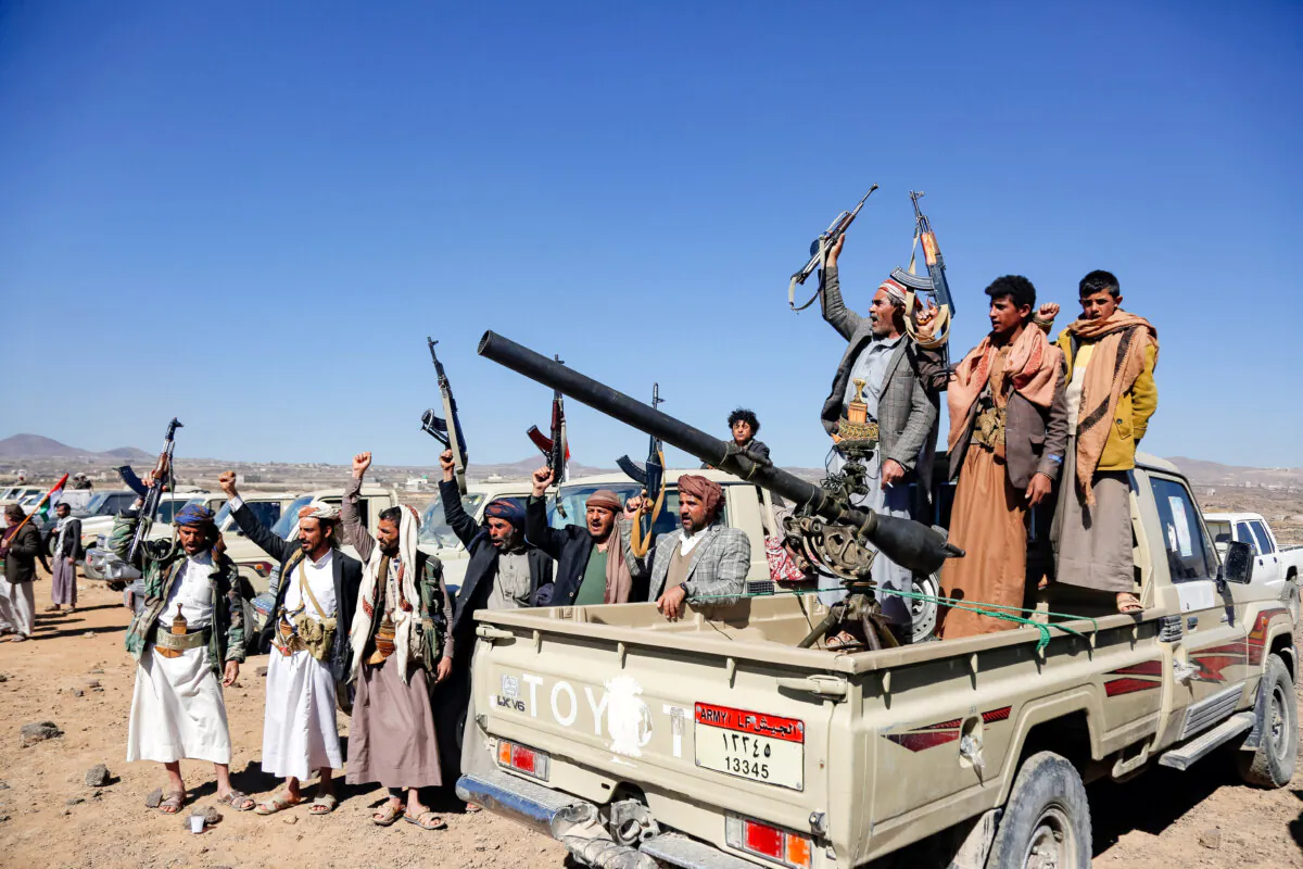 Houthi fighters and tribesmen stage a rally against U.S. and UK strikes on Houthi-run military sites near Sana'a, Yemen, on Jan. 14, 2024. (AP Photo)