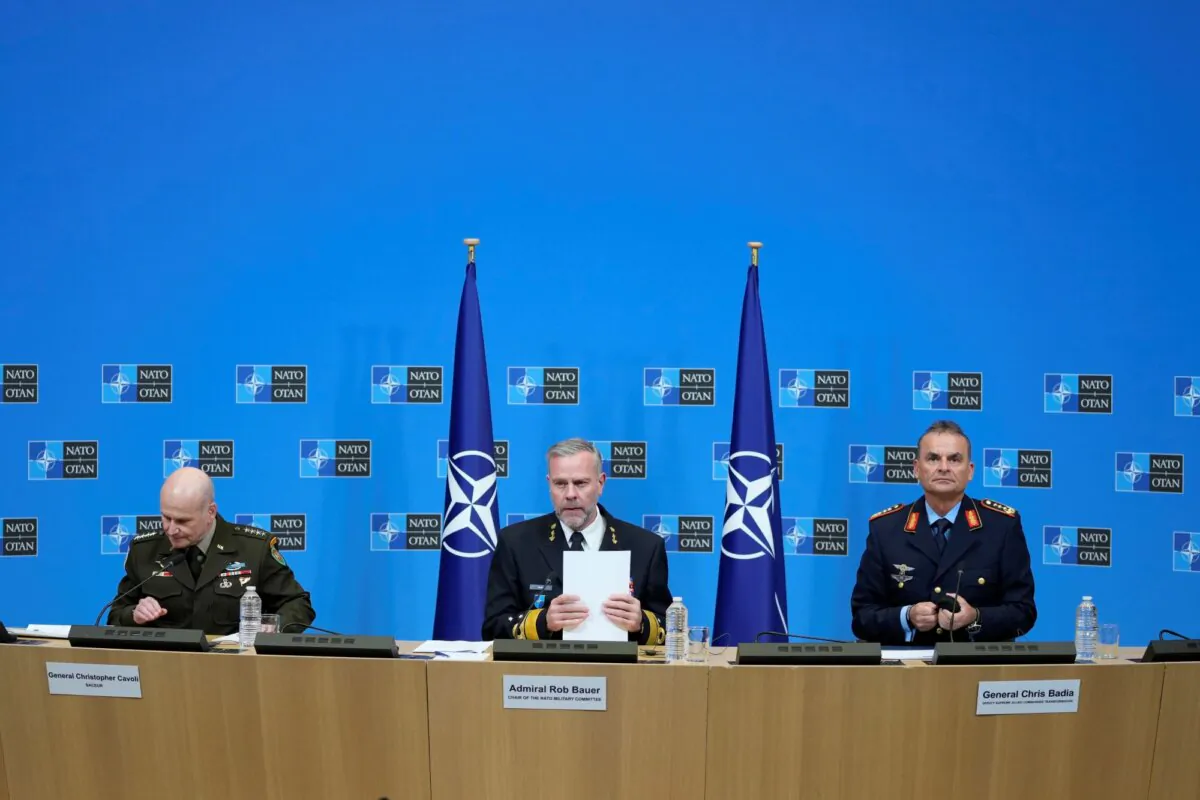 Chair of the NATO Military Committee Admiral Rob Bauer, (C), Supreme Allied Commander Europe, General Christopher Cavoli, (L), and Supreme Allied Commander Transformation General Chris Badia prepare to address a media conference at NATO headquarters in Brussels, on Jan. 18, 2024. (Virginia Mayo/AP Photo)