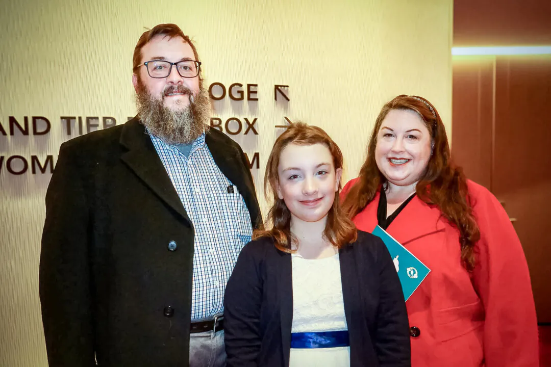 Greg and Meredith Cohoon attended Shen Yun Performing Arts with their daughter, Aurora, at the Steven Tanger Center for the Performing Arts on Jan. 18, 2024. (Nancy Han/The Epoch Times) 