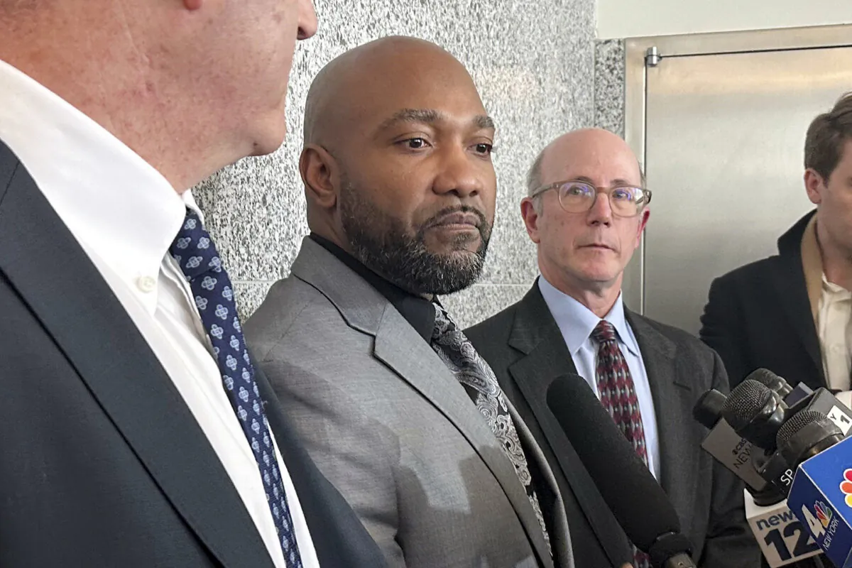 Steven Ruffin (C), who served 14 years in prison for a deadly 1990s shooting, speaks to the media in the Brooklyn borough of New York on Jan. 18, 2024, after he was was exonerated. (Jennifer Peltz/AP Photo)