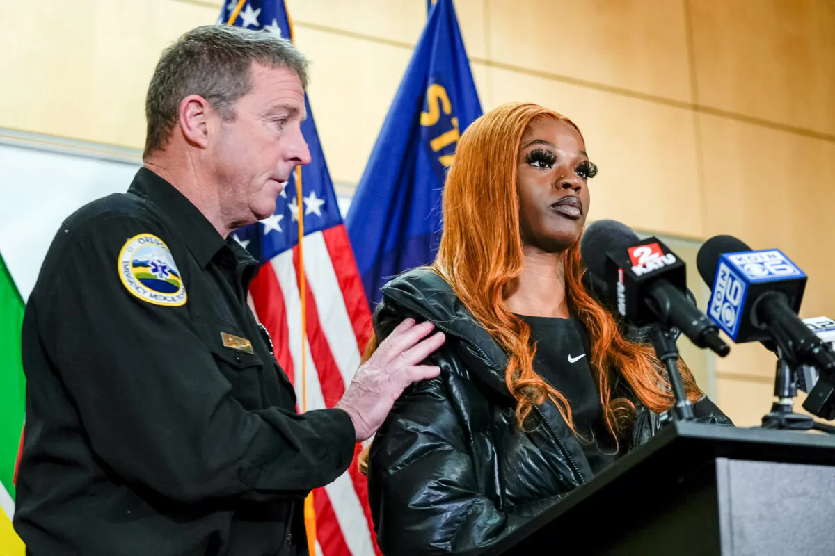 Portland Fire and Rescue spokesman Rick Graves, (L), introduces Majiah Washington to speak during a news conference at the Portland Fire & Rescue headquarters, in Portland, Ore., on Jan. 18, 2024. (Jenny Kane/AP Photo)