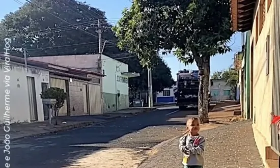 Cute Child Waves at Garbage Collectors