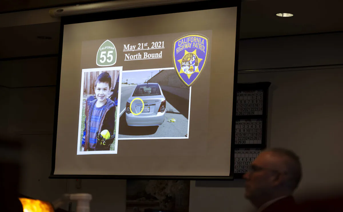 Senior Deputy District Attorney Dan Feldman shows the jury a photo of Aiden Leos and the car he was riding in during opening statements in Marcus Eriz's trial,  in Santa Ana, Calif., on Jan. 18, 2024. (Paul Bersebach/The Orange County Register via AP)