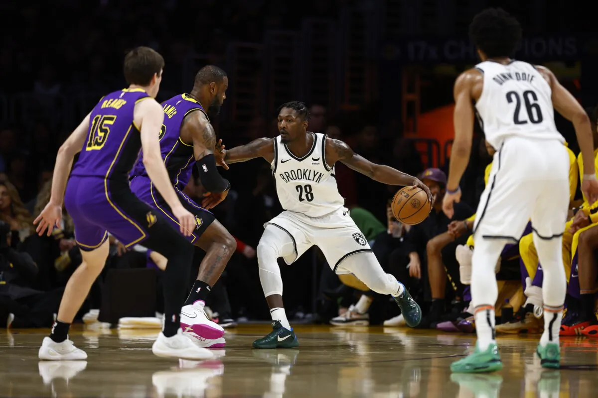 Dorian Finney-Smith (28) of the Brooklyn Nets in the first half in Los Angeles on Jan. 19, 2024.(Ronald Martinez/Getty Images)