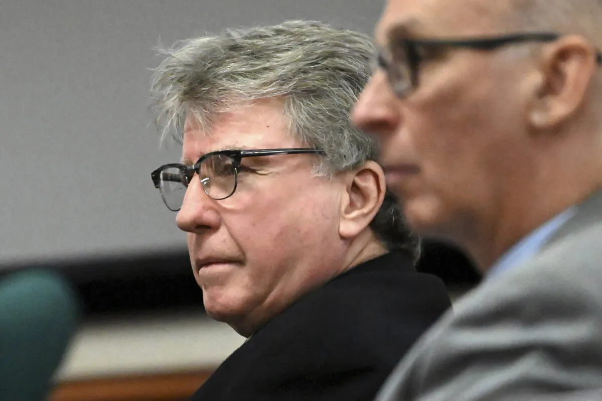 Defendant Kevin Monahan, left, listens to opening statements in his murder trial, Jan. 11, 2024, at the Washington County Courthouse in Fort Edward, N.Y. Blake Walsh, the boyfriend of a 20-year-old woman fatally shot in the neck when they pulled into the wrong driveway last year, testified Thursday, Jan. 18, 2024, in the second-degree murder trial of Monahan, 66, who is charged with fatally shooting Kaylin Gillis when the friends she was with turned into the wrong driveway near the Vermont border on a Saturday night last April. (Will Waldron/The Albany Times Union via AP, Pool, File)