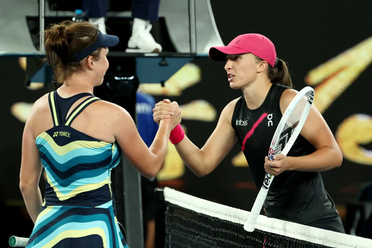 Linda Noskova of the Czech Republic (L) embraces Iga Swiatek of Poland after winning her round three singles match during the 2024 Australian Open in Melbourne, Australia on Jan. 20, 2024. (Cameron Spencer/Getty Images)