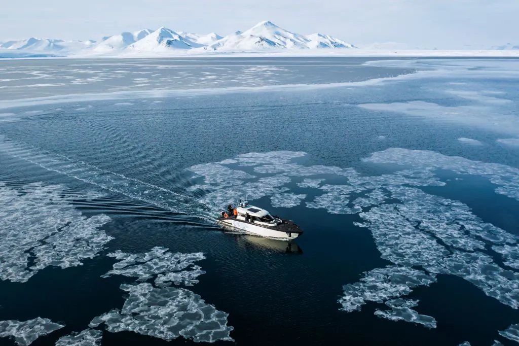 This aerial view image taken on May 3, 2022, shows the Kvitbjorn (Polar Bear, in Norwegian) as it makes its way in the sea ice in the Borebukta Bay, located at the northwestern side of Isfjorden, in Svalbard Archipelago, northern Norway. (Jonathan Nackstrand/AFP via Getty Images)