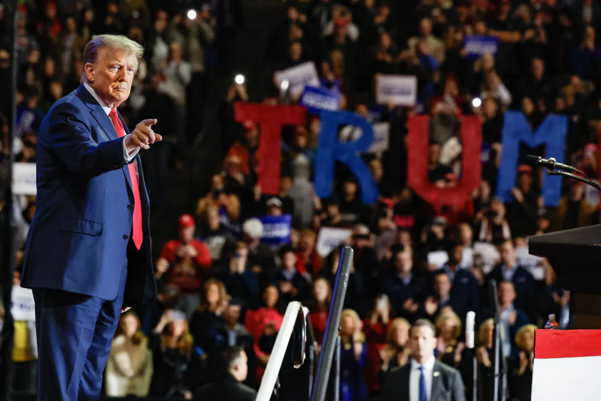 Republican presidential front-runner and former President Donald Trump takes the stage during a campaign rally at the SNHU Arena in Manchester, N.H., on Jan. 20, 2024. (Chip Somodevilla/Getty Images)