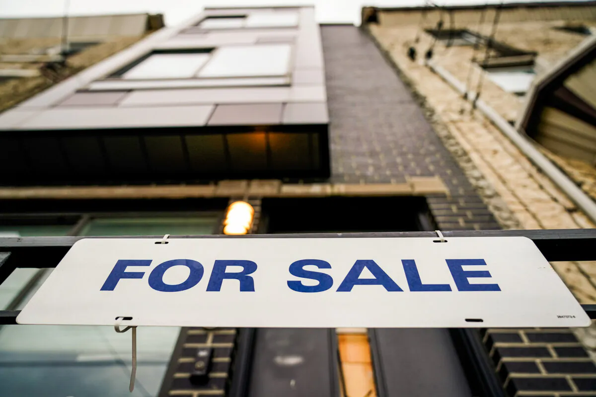 A "For Sale" sign is posted outside a single-family home in Philadelphia on Dec. 1, 2023. (Matt Rourke/AP Photo)