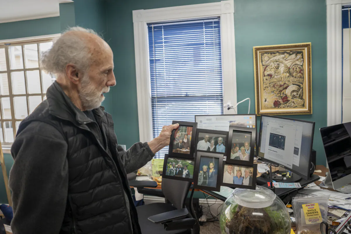 New Hampshire Democrat Ron King shows off his photo display of famous faces during an interview with The Epoch Times in his office in Concord, N.H., on Jan. 19, 2024. (Madalina Vasiliu/The Epoch Times)