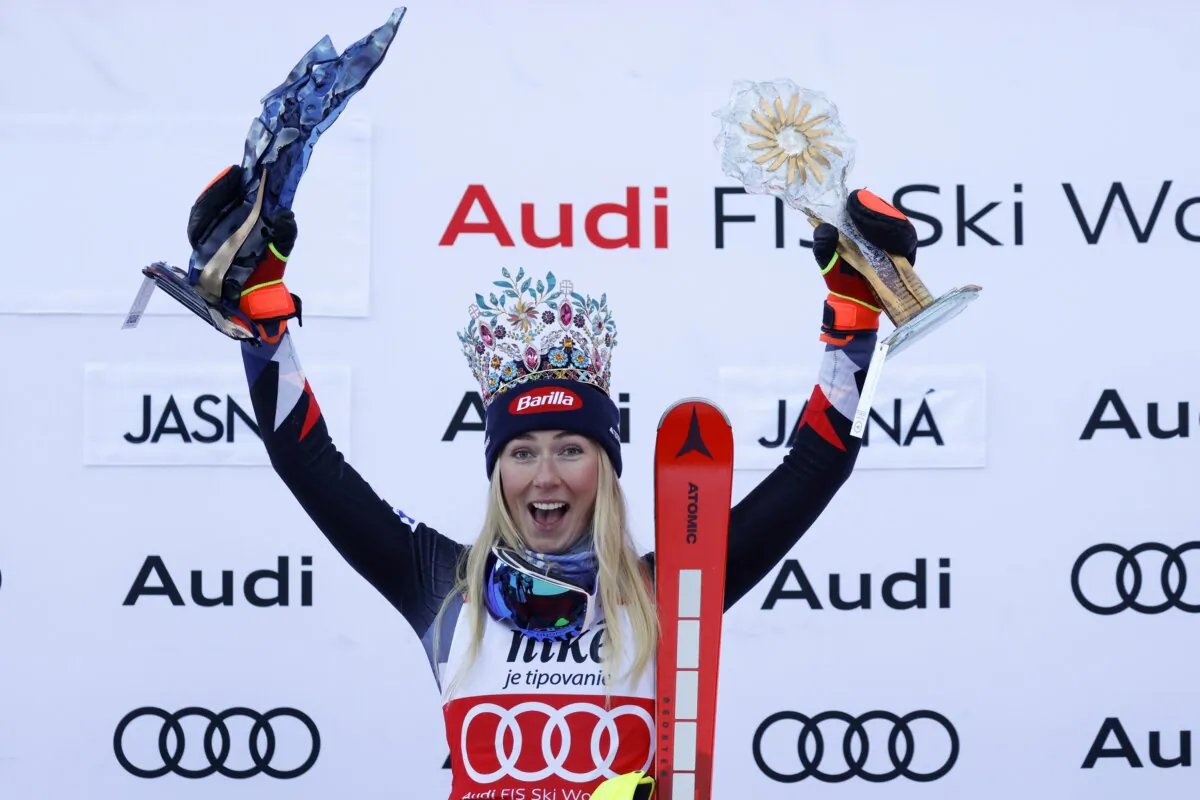 United States' Mikaela Shiffrin celebrates on the podium after winning an alpine ski women's World Cup slalom race in Jasna, Slovakia, on Jan. 21, 2024. (Giovanni Maria Pizzato/AP Photo)