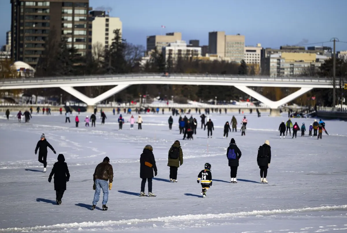 People skate on the Rideau Canal Skateway on its opening day in Ottawa, on Jan. 21, 2024. (The Canadian Press/Justin Tang)