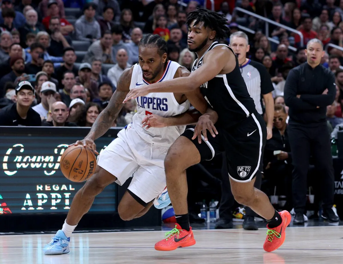 Kawhi Leonard (2) of the LA Clippers drives to the basket on Cam Thomas (24) of the Brooklyn Nets during Clippers win in Los Angeles on Jan. 21, 2024. (Harry How/Getty Images)