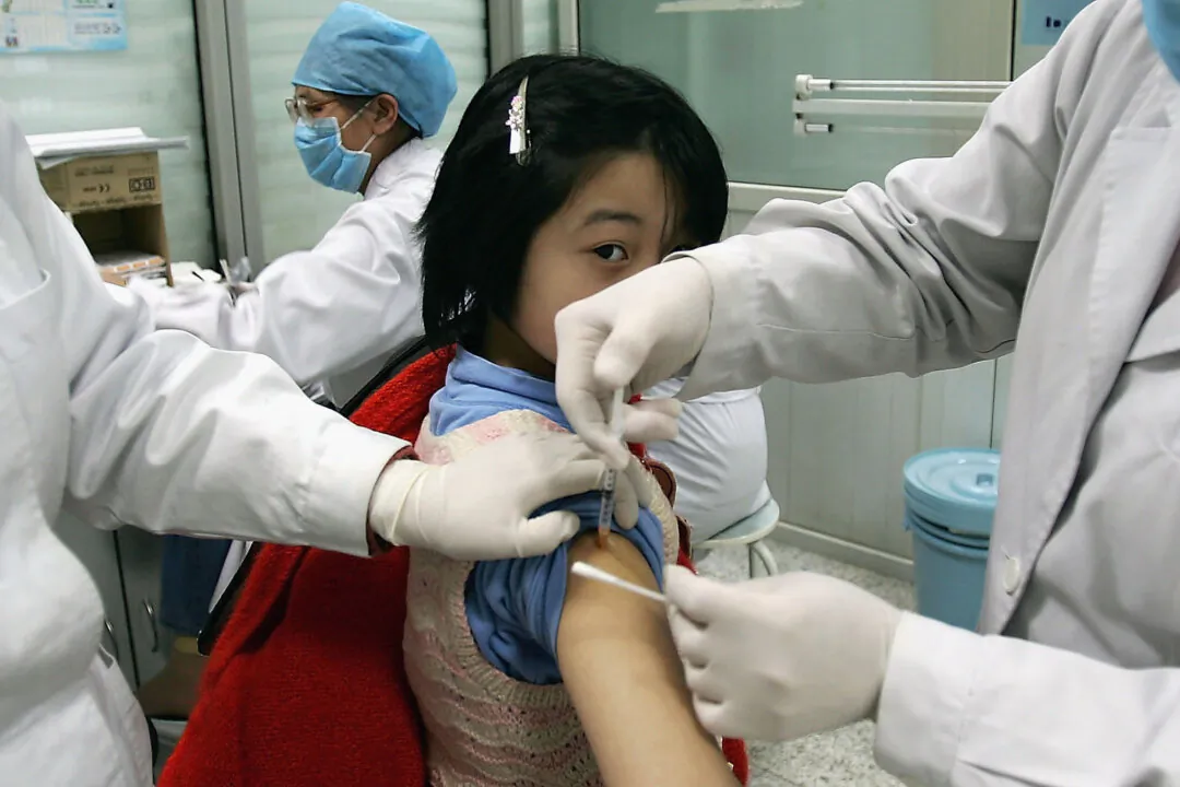 A child is vaccinated against bacterial meningitis in Beijing on Feb. 3, 2005. (Guang Niu/Getty Images)