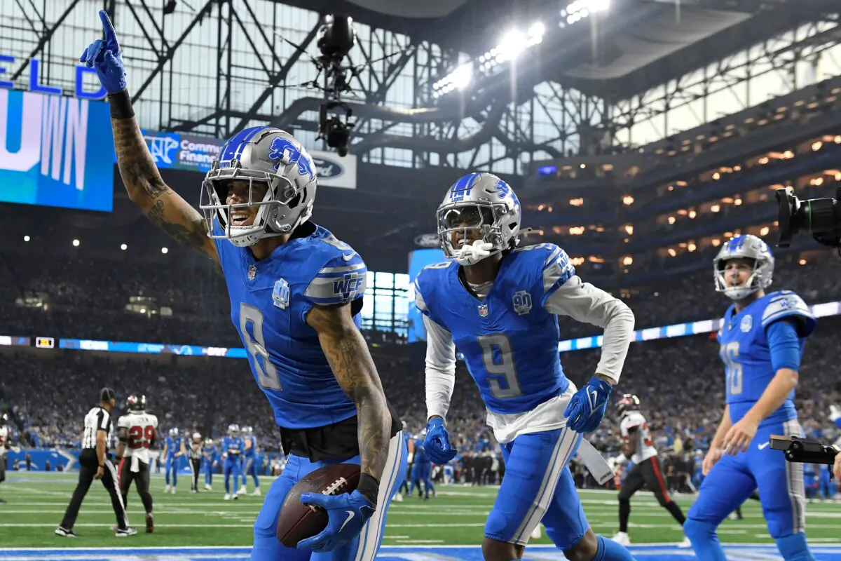 Detroit Lions wide receiver Josh Reynolds (8) celebrates with teammates Jameson Williams (9) and Jared Goff (16) after scoring a touchdown against the Tampa Bay Buccaneers during the first half of an NFL football NFC divisional playoff game in Detroit on Jan. 21, 2024. (Jose Juarez/AP Photo)