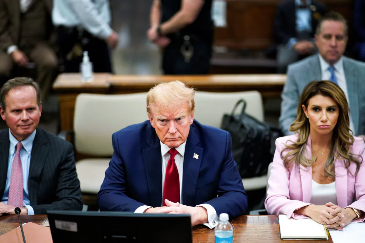 Former U.S. President Donald Trump sits at the defense table with his attorneys Christopher Kise (L) and Alina Habba (R) in New York State Supreme Court on December 7, 2023 in New York City.
(Eduardo Munoz Alvarez-Pool/Getty Images)