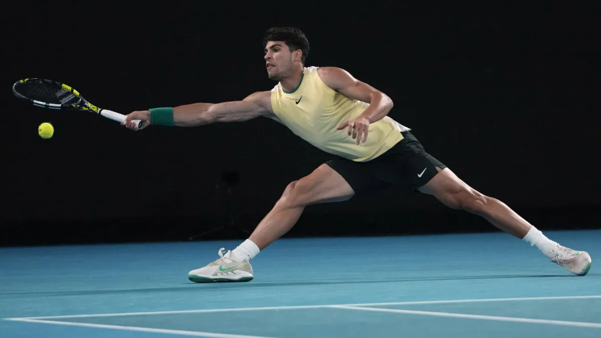 Carlos Alcaraz of Spain plays a forehand return to Miomir Kecmanovic of Serbia during their fourth round match at the Australian Open tennis championships at Melbourne Park, Melbourne, Australia, on Jan. 22, 2024. (Andy Wong/AP Photo)