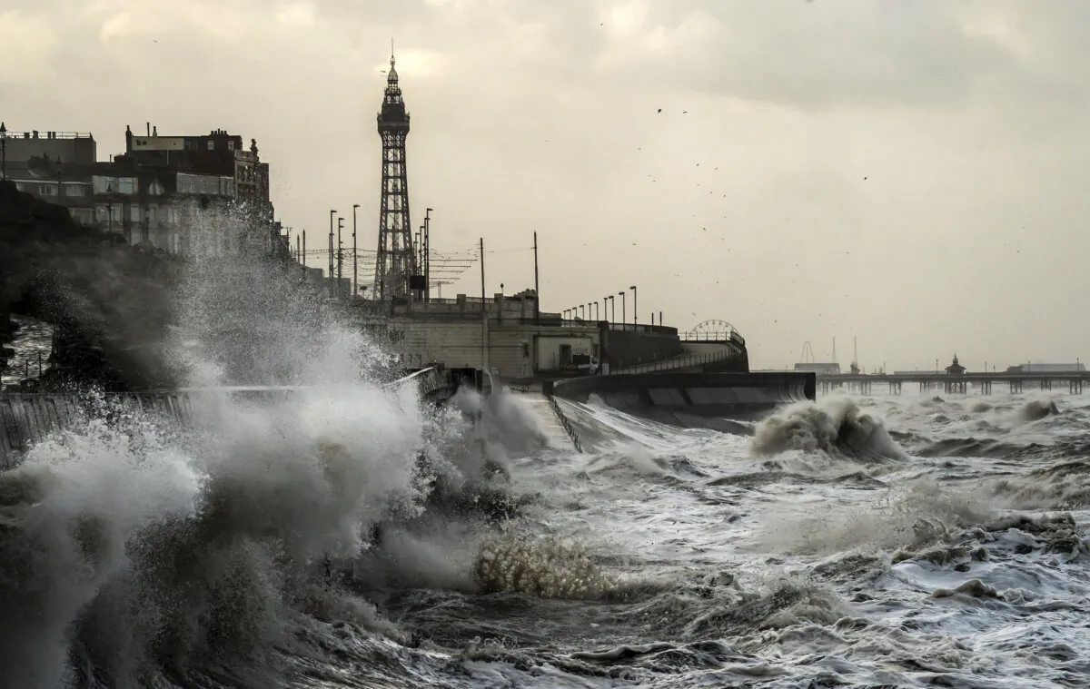 Waves break on the sea front in Blackpool, England, on Jan. 22, 2024. (Danny Lawson/PA via AP)