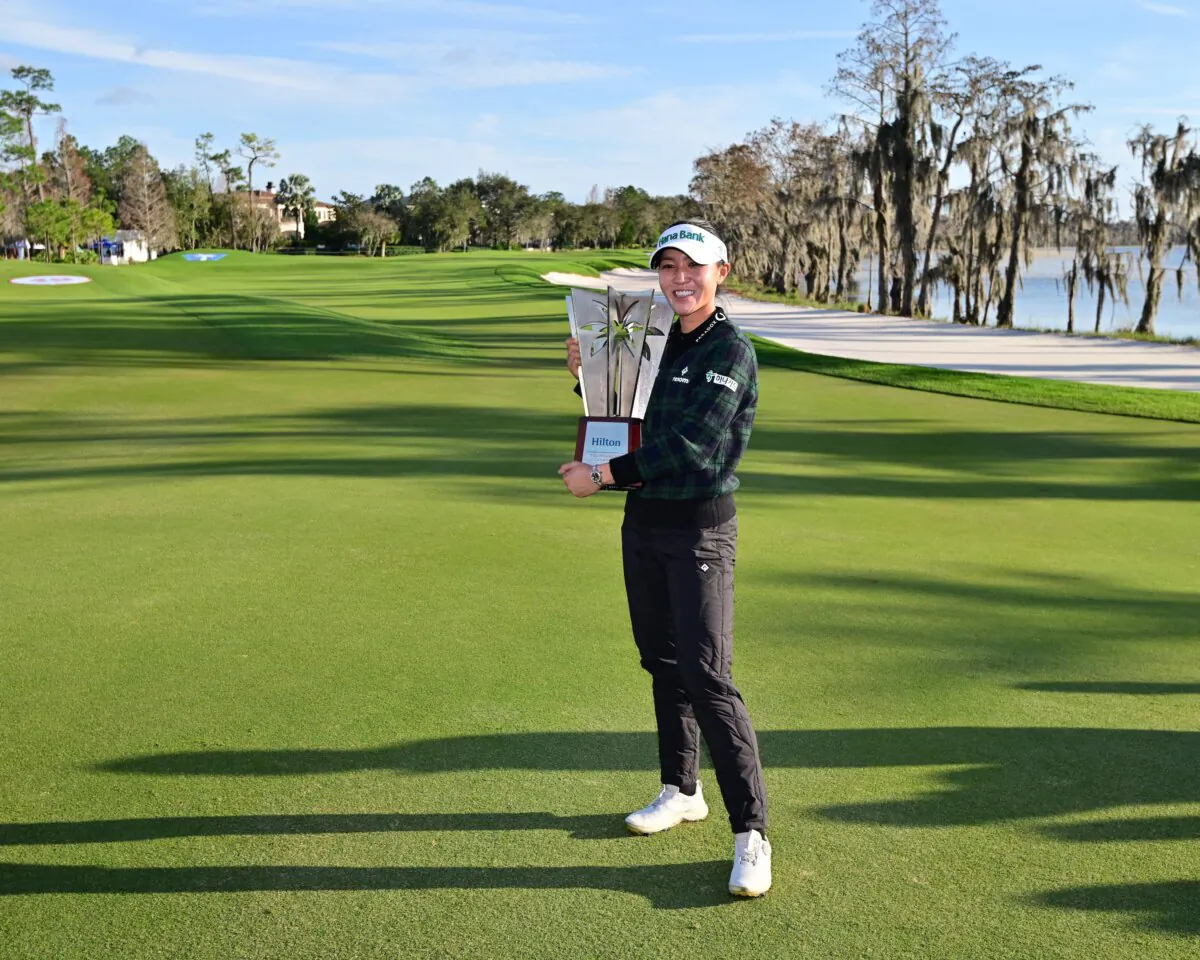 Lydia Ko of New Zealand poses with the trophy after winning the Hilton Grand Vacations Tournament of Champions in Orlando on Jan. 21, 2024. (Julio Aguilar/Getty Images)