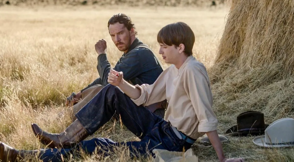 Phil Burbank (Benedict Cumberbatch (L) teaching Peter Gordon (Kodi Smit-McPhee) the ways of manhood, in “The Power of the Dog.” (Netflix)