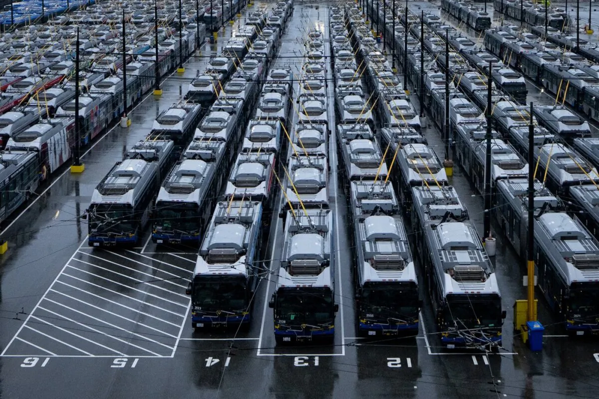 Buses line the Vancouver Transit Centre as transit workers from the Canadian Union of Public Employees Local 4500 strike in Vancouver, B.C., on Jan. 22, 2024. (The Canadian Press/Ethan Cairns)