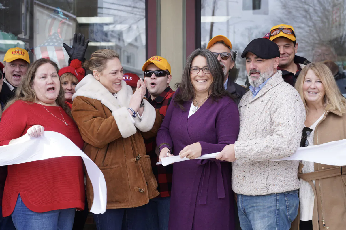 Dorey Houle (C), flanked by Alison Esposito (2nd L) and Anthony Houle (2nd R), cuts a ribbon on her new campaign office for the state Senate race, in Florida, N.Y., on Jan. 20, 2024. (Cara Ding/The Epoch Times)