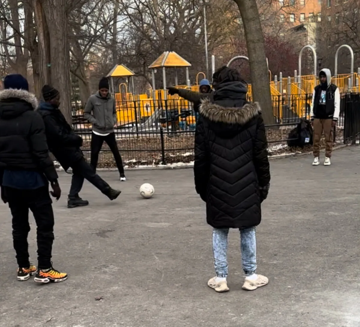 Illegal immigrants playing soccer at Tompkins Square Park to keep warm, on Jan. 22, 2024. (Juliette Fairley)