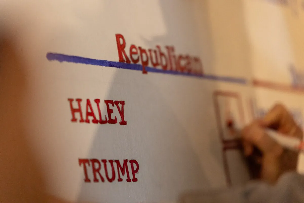 An election administrator fills in the results of the midnight primary in Dixville Notch, N.H., shortly after midnight on Jan. 23, 2024. (John Fredricks/Epoch Times)