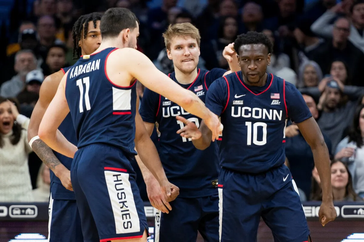 UConn's Hassan Diarra (R), celebrates with his teammates after drawing a foul during the second half of the team's NCAA college basketball game against Villanova in Philadelphia on Jan. 20, 2024. (Chris Szagola/AP Photo)