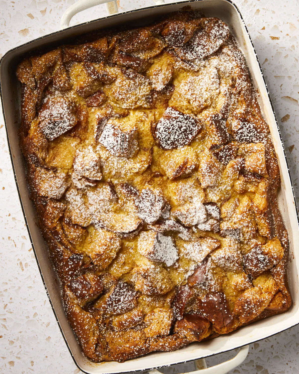 Chunks of toasted challah are soaked in a spiced vanilla custard, then baked, for an easy, crowd-pleasing dessert. (Vicky Wasik/TNS)