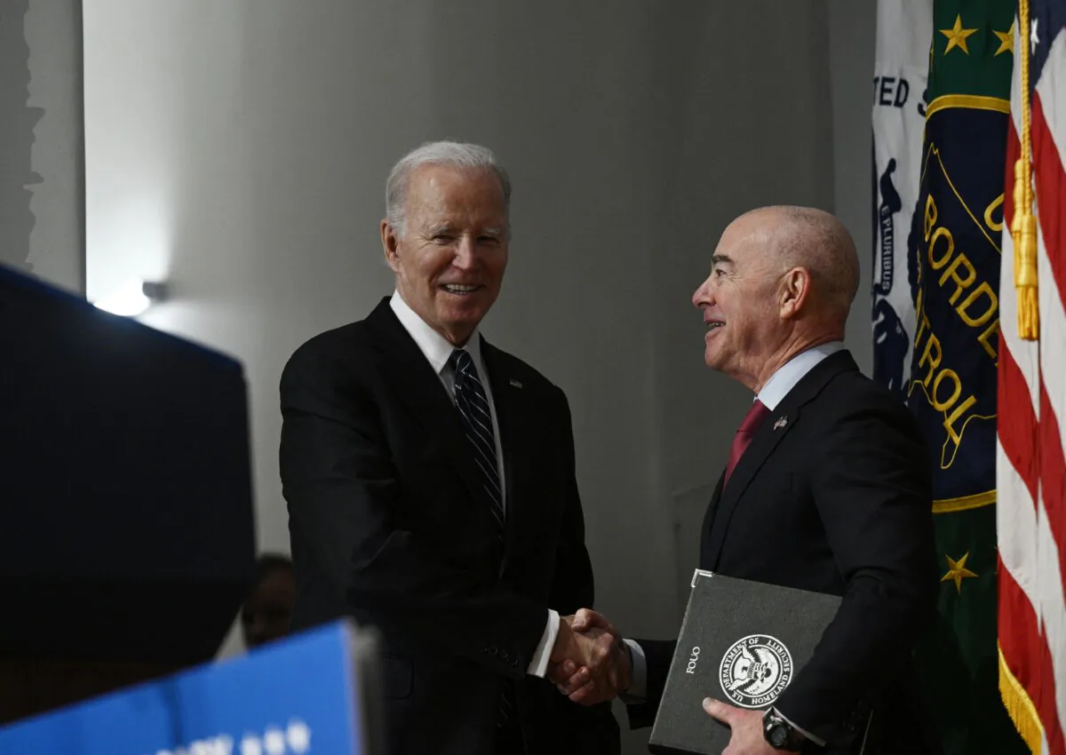 President Joe Biden (L) greets Homeland Security Secretary (DHS) Alejandro Mayorkas as he arrives to speak at the DHS 20th Anniversary Ceremony at DHS headquarters in Washington, D.C., on March 1, 2023. (Brendan Smialowski/AFP via Getty Images)