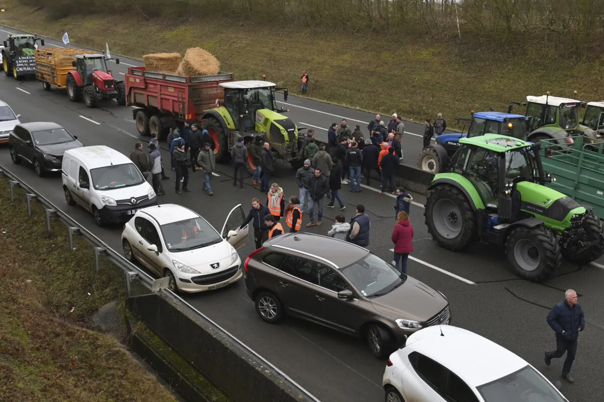 Farmers block a highway during a demonstration near Beauvais, northern France, on Jan. 23, 2024. (Matthieu Mirville/AP Photo)