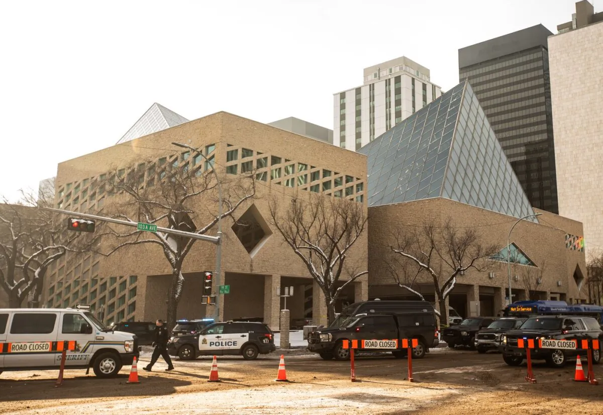Police surround Edmonton City Hall during an investigation on Jan. 23, 2024. (The Canadian Press/Jason Franson)
