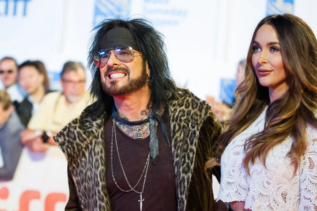 Nikki Sixx of Motley Crew and his wife Courtney pose for photographers during the premiere of the film 'Long Time Running' at the Toronto International Film Festival in Toronto, Ontario, Sep. 13, 2017. (Geof Robins/AFP via Getty Images)
