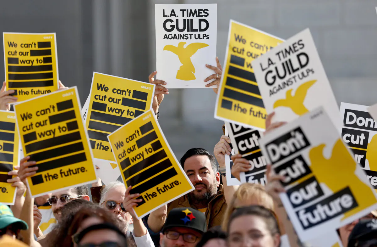 Los Angeles Times Guild members during a rally outside City Hall against imminent layoffs at the newspaper during a one-day walkout in Los Angeles on Jan. 19, 2024. (Mario Tama/Getty Images)