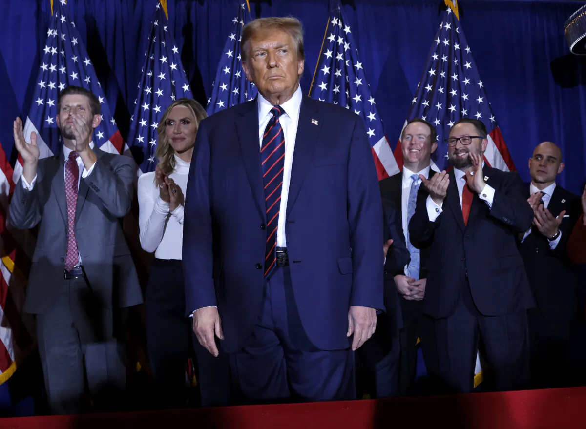 Republican presidential candidate and former U.S. President Donald Trump takes the stage with supporters, campaign staff, and family members for a primary night party at the Sheraton in Nashua, N.H., on Jan. 23, 2024. (Chip Somodevilla/Getty Images)