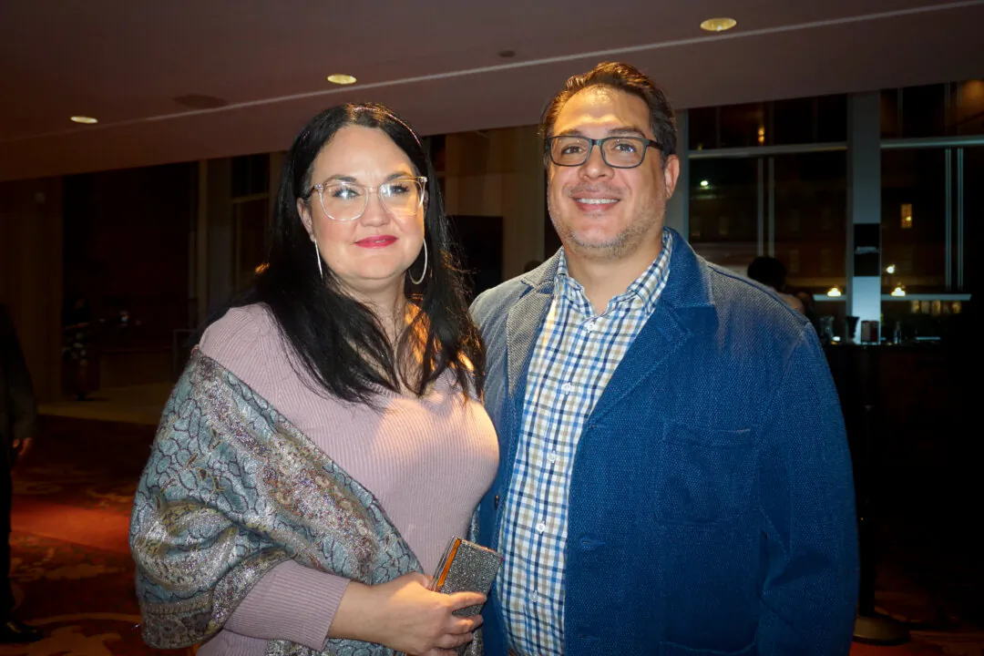 Eduardo Pesante (R) enjoyed Shen Yun's evening performance at the River Center for the Performing Arts, in Columbus, on Jan. 23, 2024. (Yeawen Hung/The Epoch Times)
