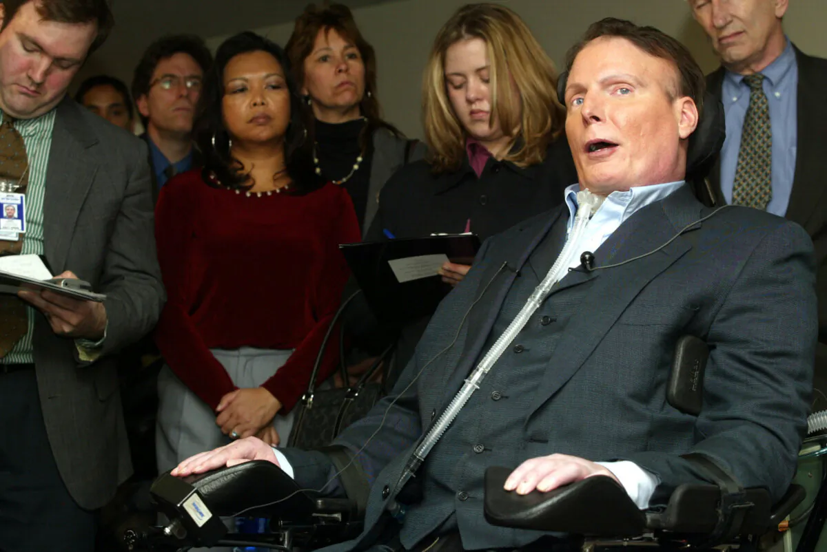 Actor Christopher Reeve speaks to reporters on Capitol Hill in Washington, prior to a hearing on "The Dangers of Cloning and The Promise of Regenerative Medicine" before the Senate Committee on Health, Education, Labor and Pensions on March 5, 2002. (Alex Wong/Getty Images)