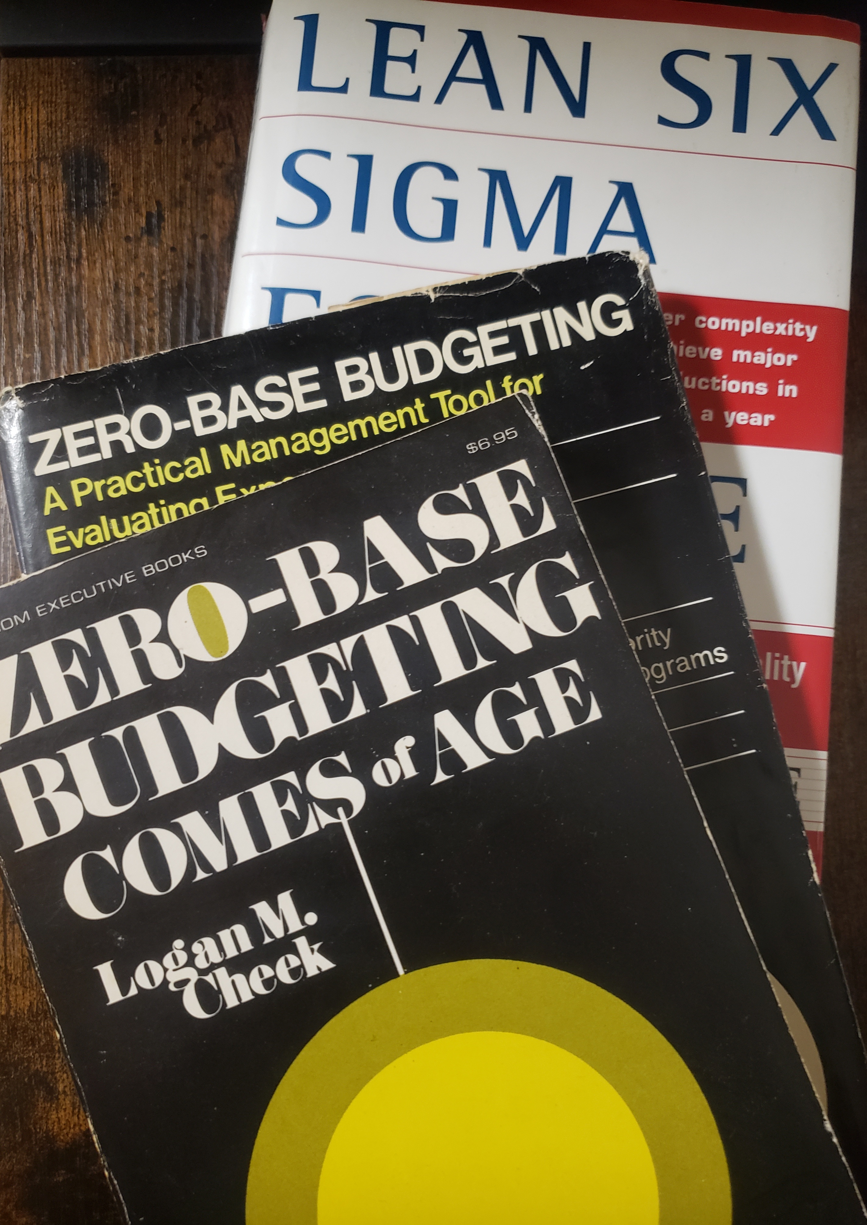 Collage of “Zero Base Budgeting” and “Lean/6σ” books from author's library. (© 2024. J.G. Collins. All rights reserved. Used by permission.)