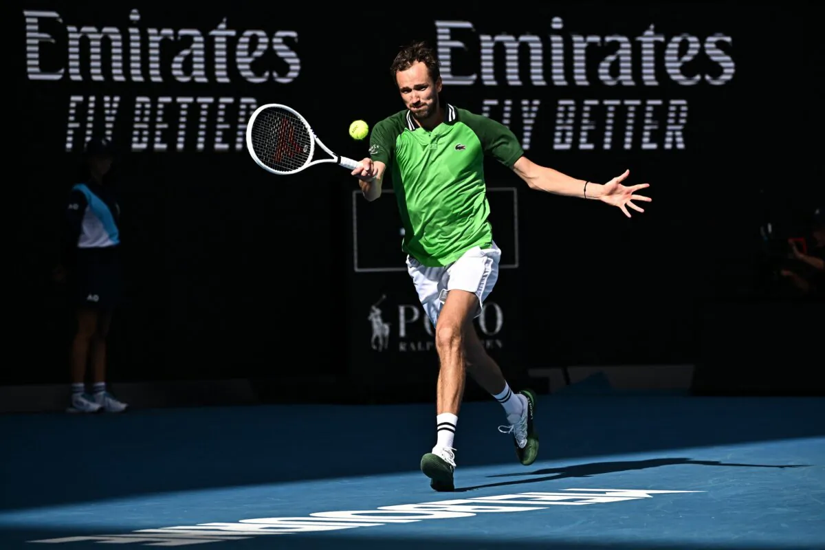Russia's Daniil Medvedev returns to Poland's Hubert Hurkacz during their men's singles quarter-final match on day 11 of the Australian Open tennis tournament in Melbourne on Jan. 24, 2024. (Lillian Swwanrumpha/ AFP)